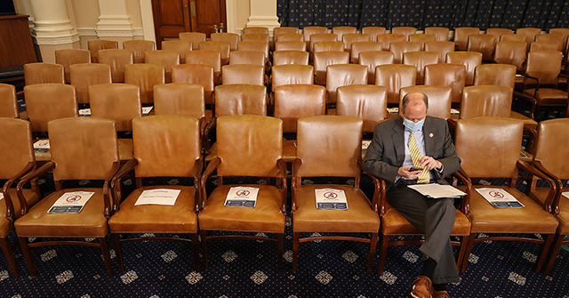 Members of Congress are spaced apart for social distancing during a House Rules Committee hearing.