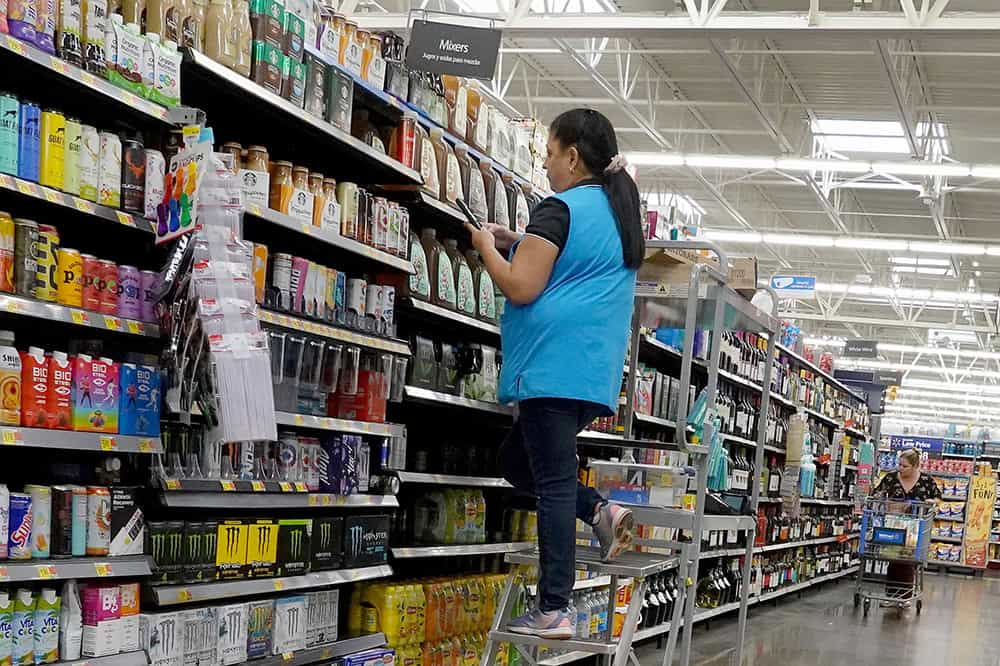 A worker stocks the shelves