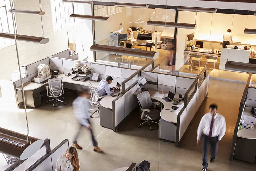 Elevated view of staff working in a busy open plan office