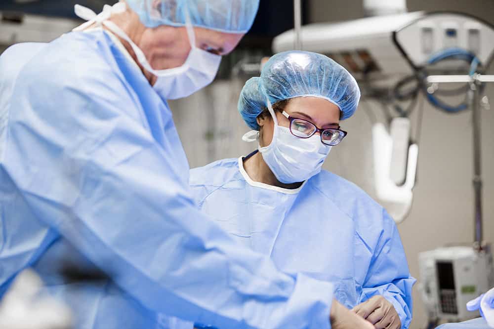 Surgeons working in operating room