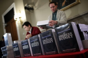 WASHINGTON, DC - FEBRUARY 12: Staff members display recently released printed copies of U.S. President Donald Trump's fiscal year 2019 budget at the House Budget Committee on Capitol Hill February 12, 2018 in Washington, DC. The budget is expected to contain funding requests for the building of a wall on the southern border of the U.S., infrastructure projects, and increased military funding. (Photo by Win McNamee/Getty Images)