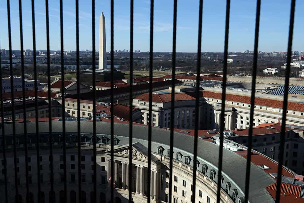 A view of the Washington Monument seen between wires that cover the windows on the observation deck of the Old Post Office Tower January 11, 2019 in Washington, DC. While thousands of National Park Service employees are on furlough and parks and sites are closed across the country due to the partial federal government shutdown.