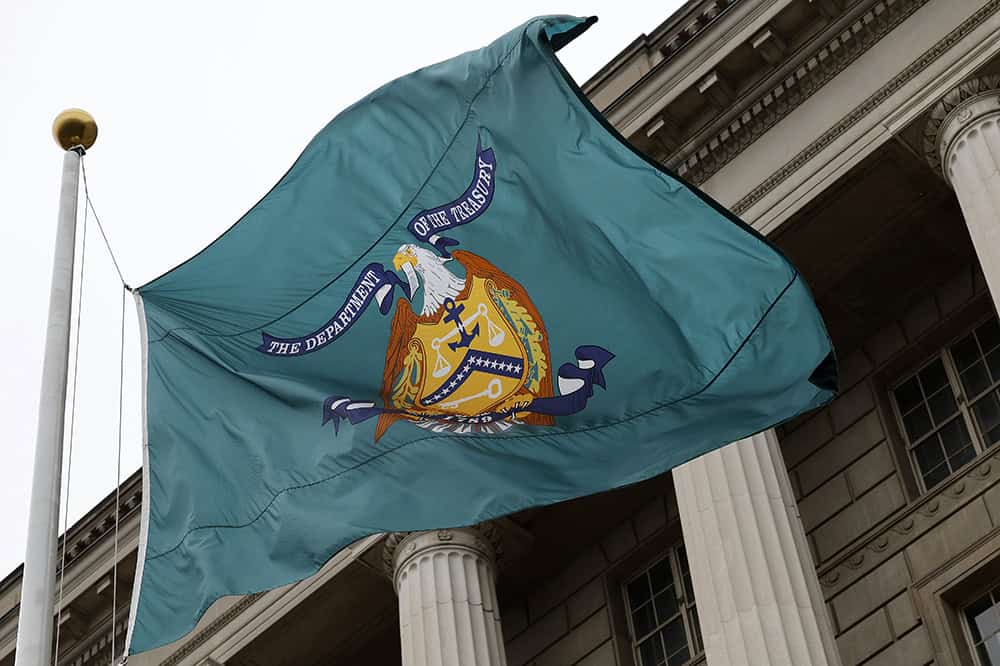 A flag with the seal of the Treasury Department