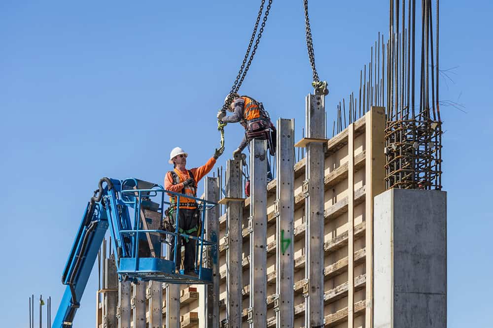 Workers on concrete wall form