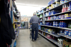 An older customer shops in a Walmart Supercenter