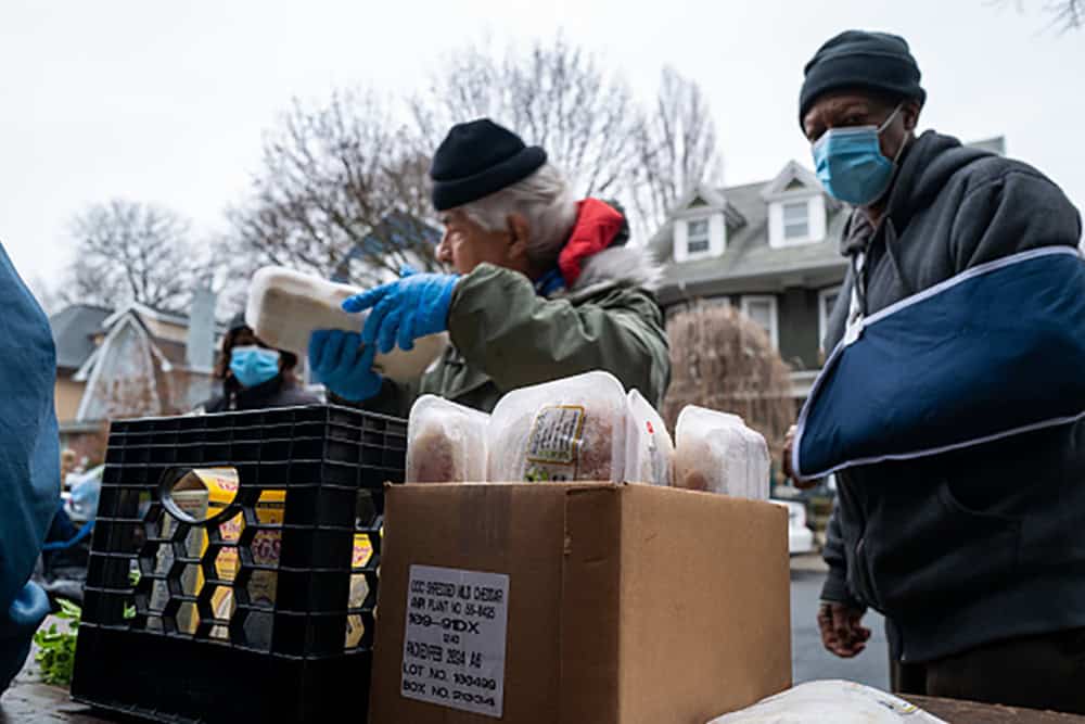 Free food is distributed to residents in need at a weekly food bank