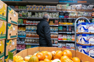 Person standing in a grocery aisle.